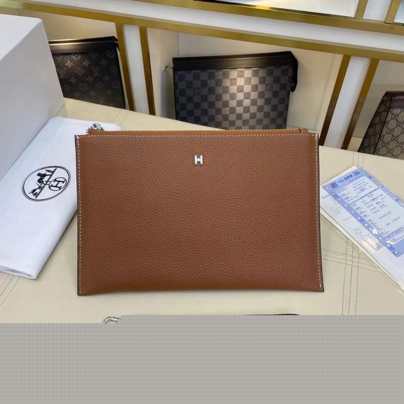 H**mes clutch bags